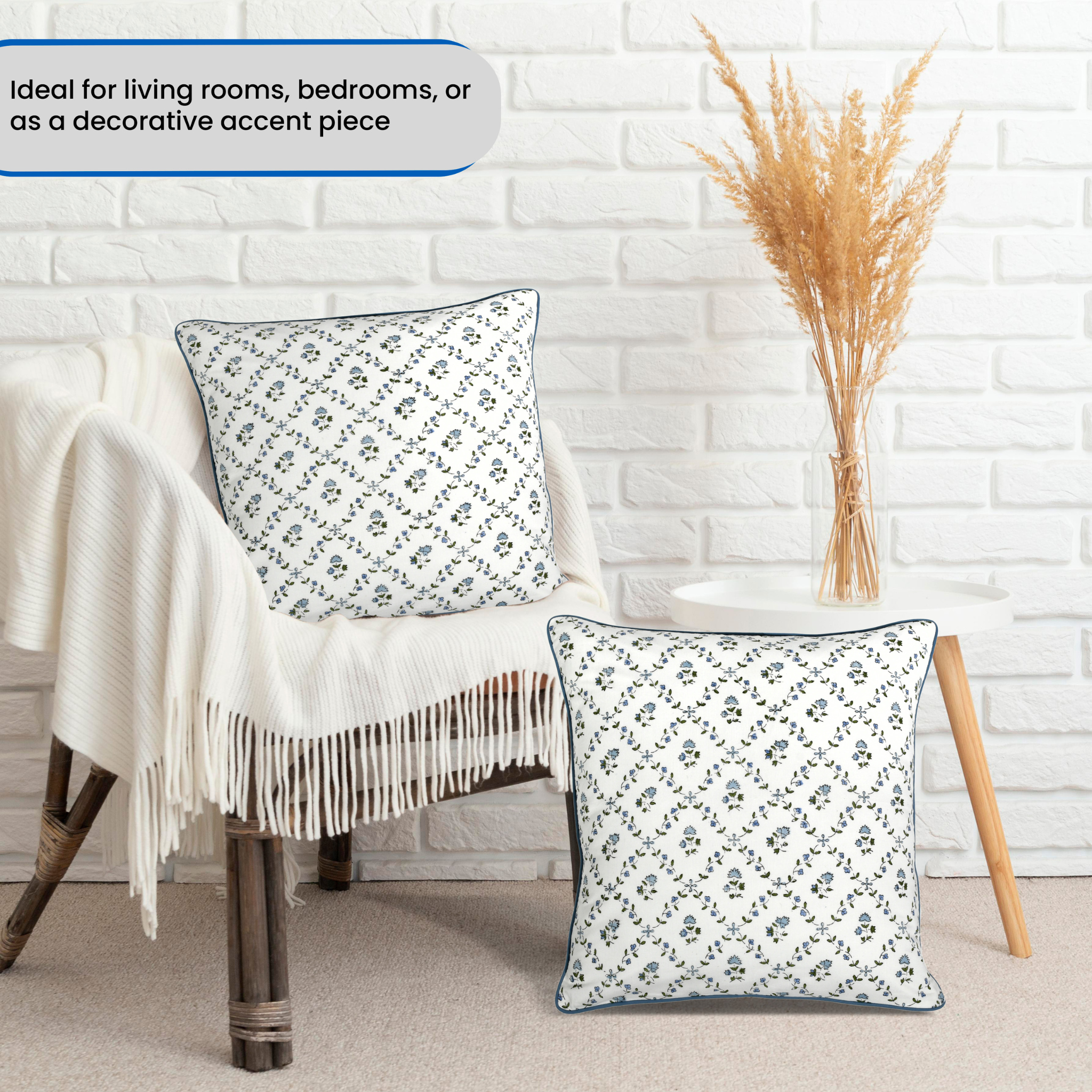 Decorative pillows on a chair with a white brick wall background
