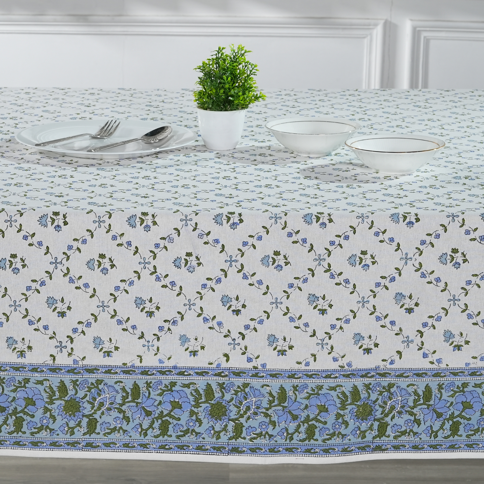 Tablecloth with floral pattern on a dining table setup
