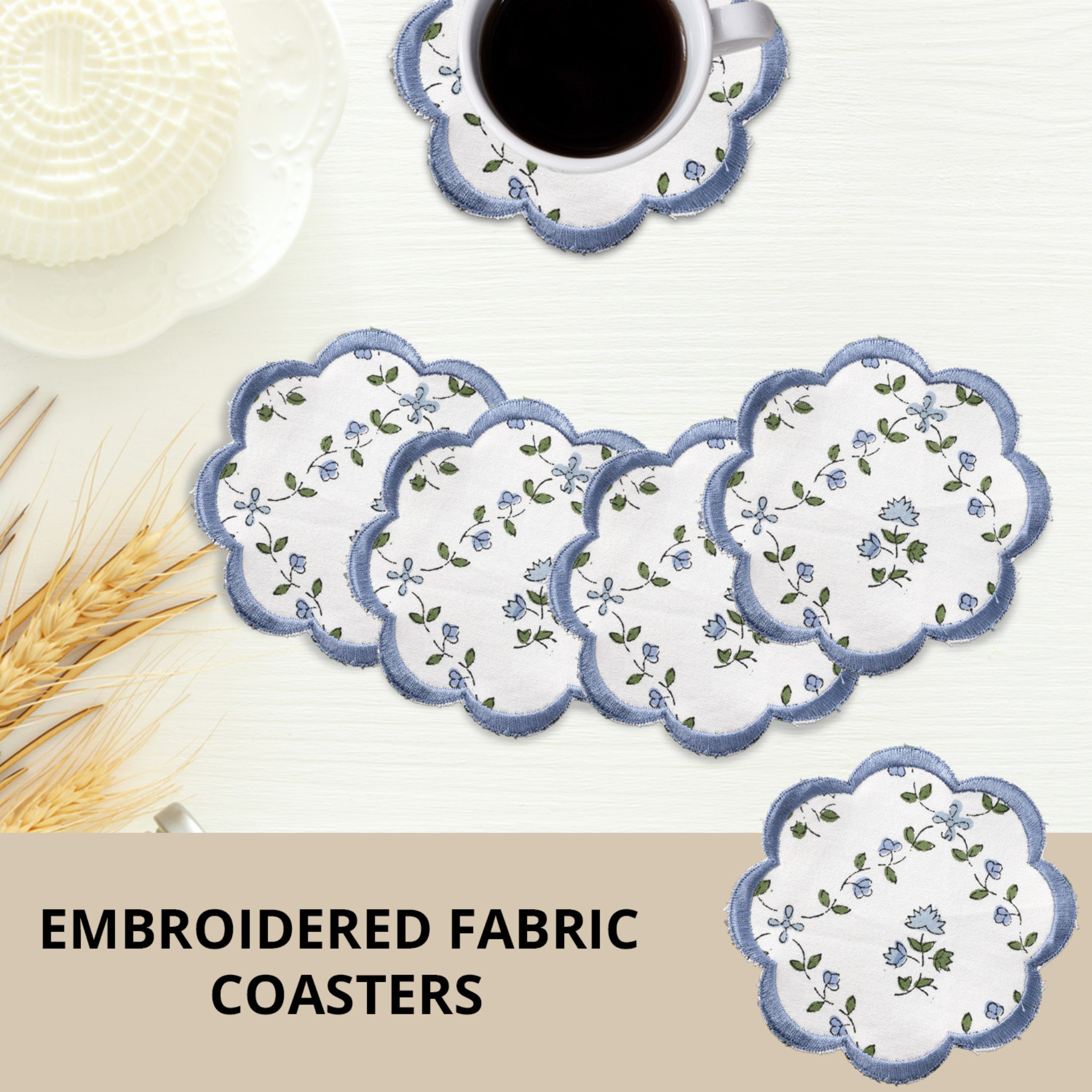 Set of embroidered fabric coasters with a cup of coffee on a white surface.