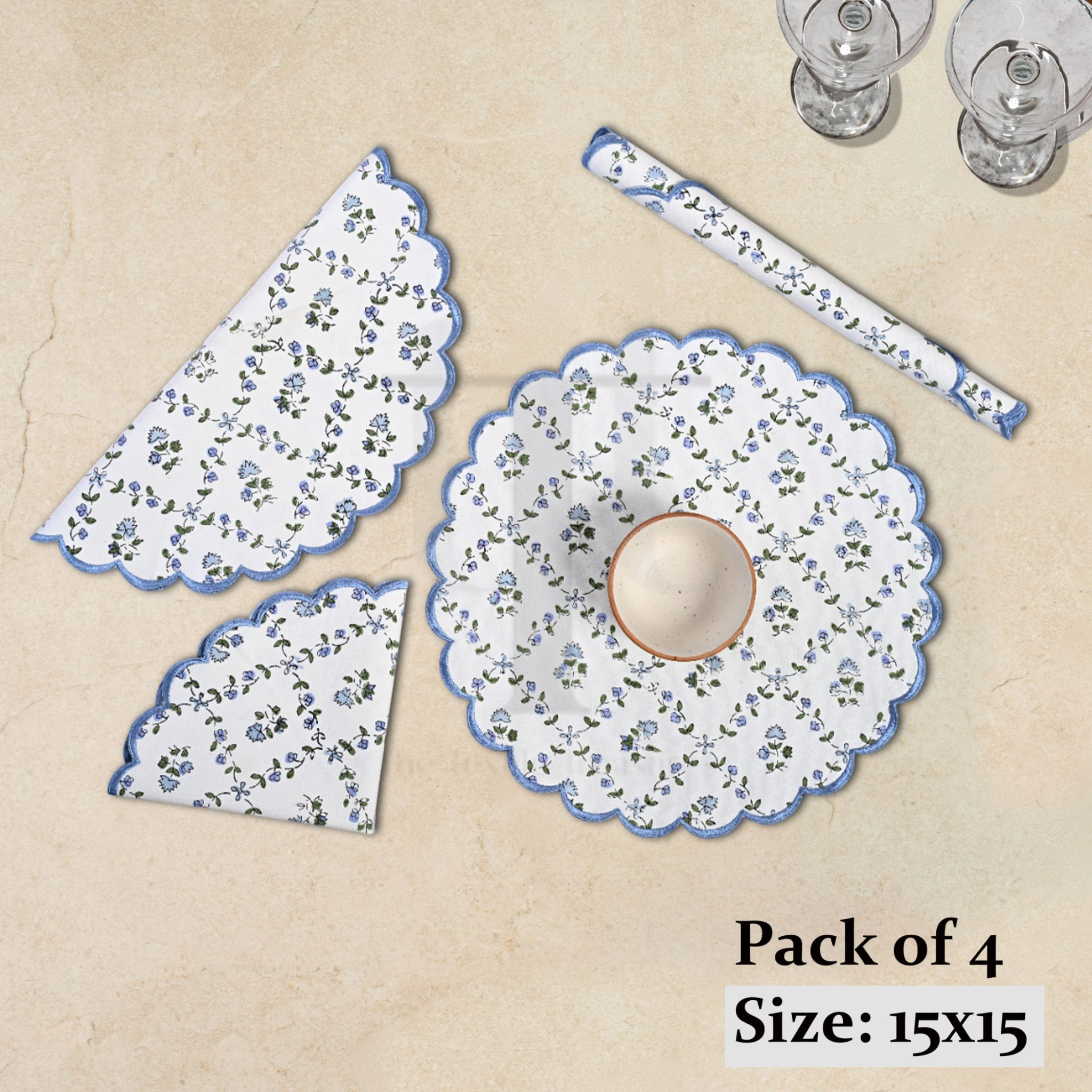 Set of floral placemats and coasters on a beige background with text indicating 'Pack of 4' and size '15x15'.