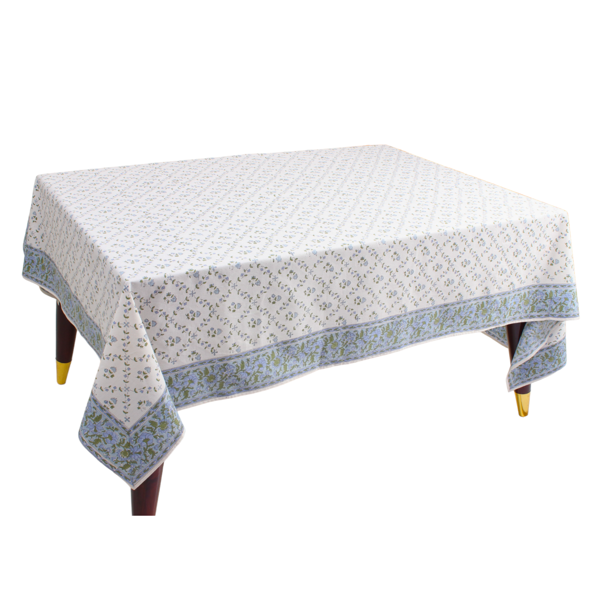 Tablecloth with floral pattern on a wooden table against a white background