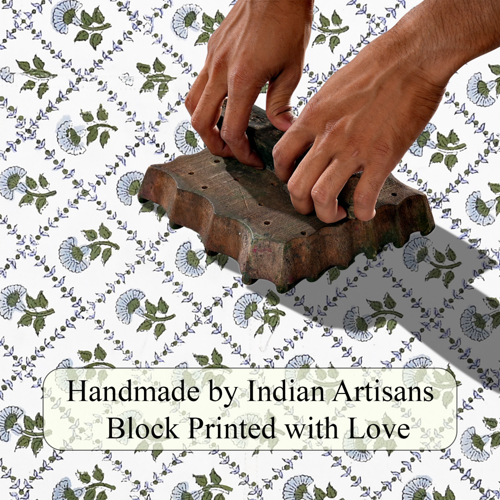 Hand block printing on fabric with text 'Handmade by Indian Artisans Block Printed with Love'.