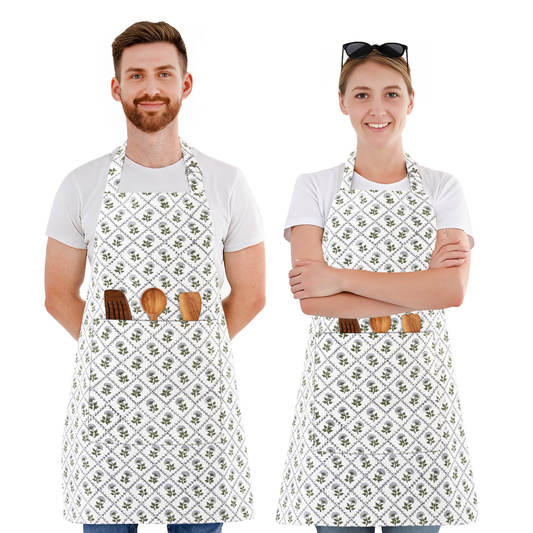 Two people wearing white aprons with floral patterns and wooden tool holders on a white background.