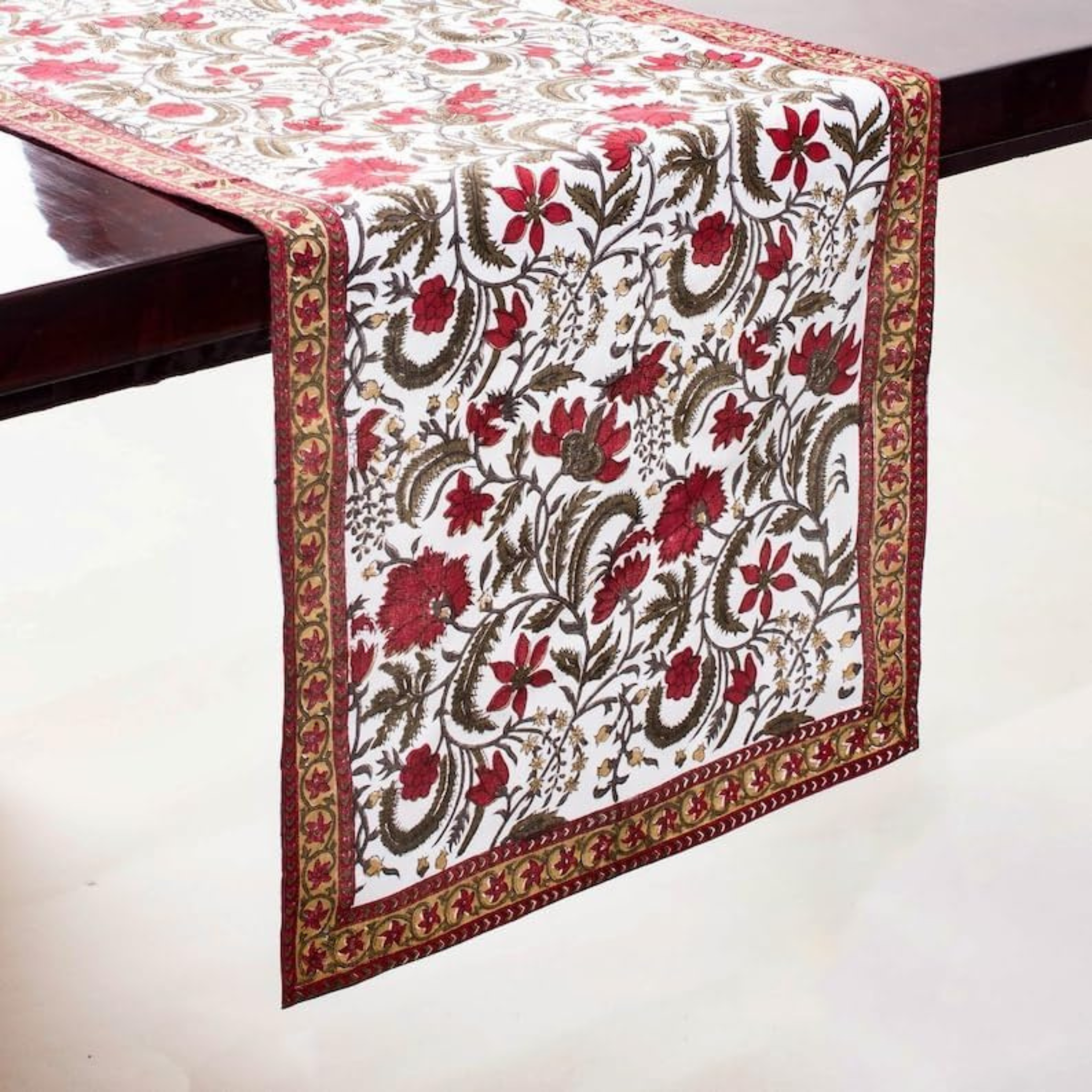 Floral patterned table runner on a wooden table
