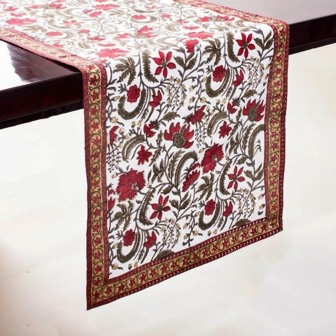 Floral patterned table runner on a wooden table