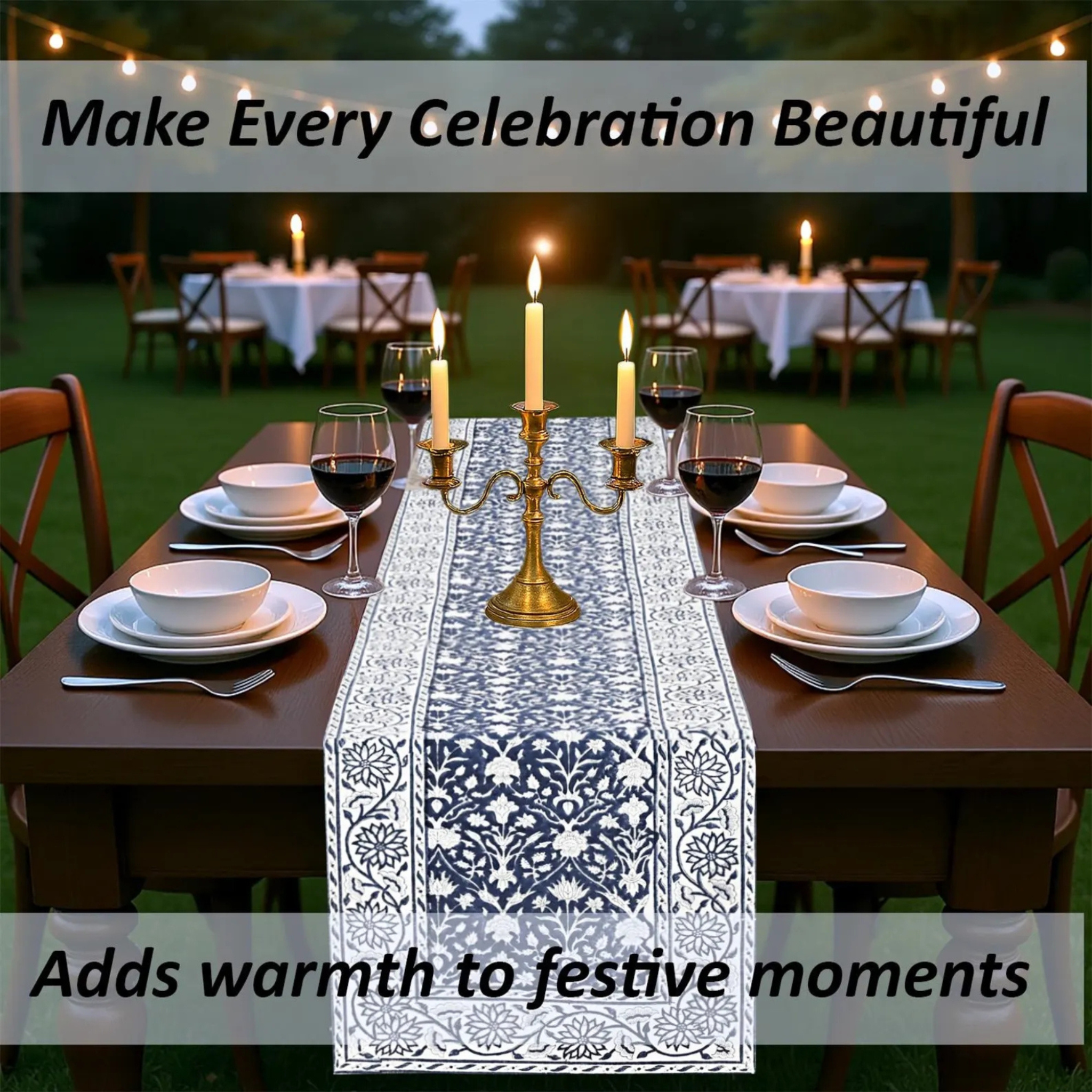 Dining table set for a celebration with candles, wine glasses, and a decorative table runner.