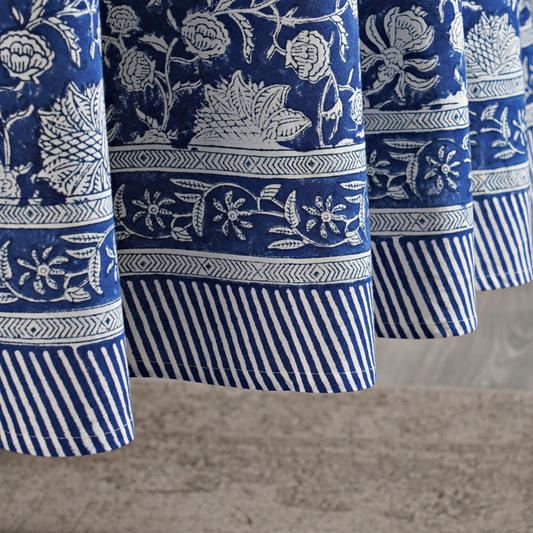 Close-up of blue and white patterned fabric with a neutral background