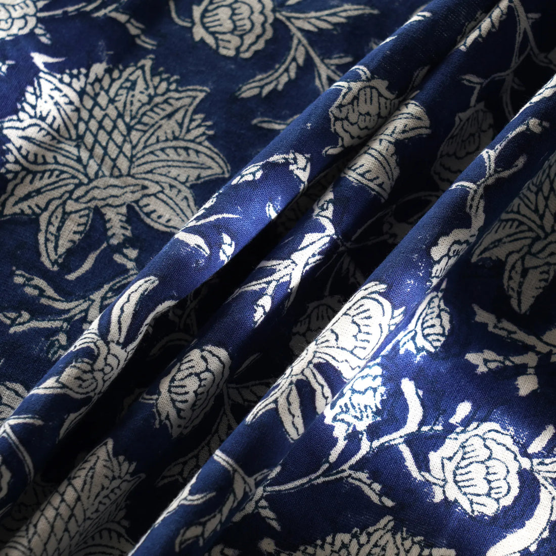 Blue fabric with white floral patterns