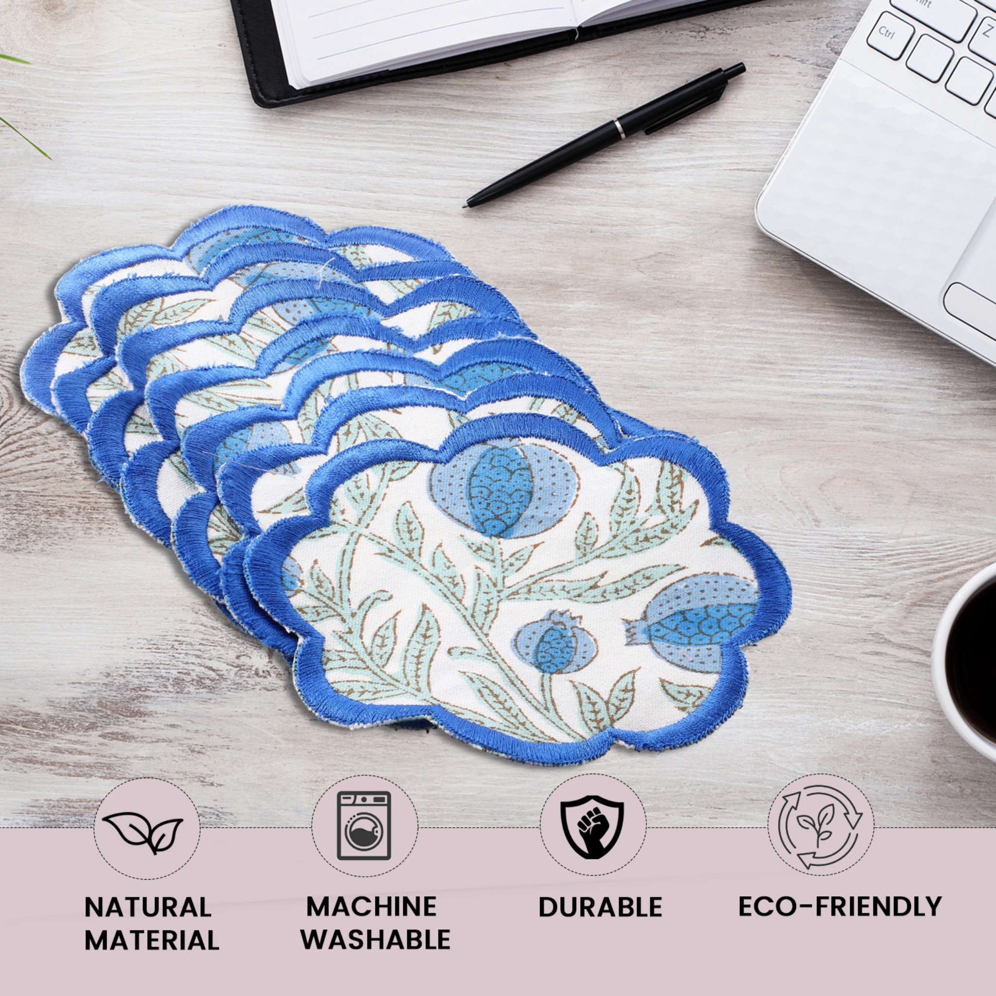 Set of floral-patterned pads on a desk with office supplies and product features highlighted.