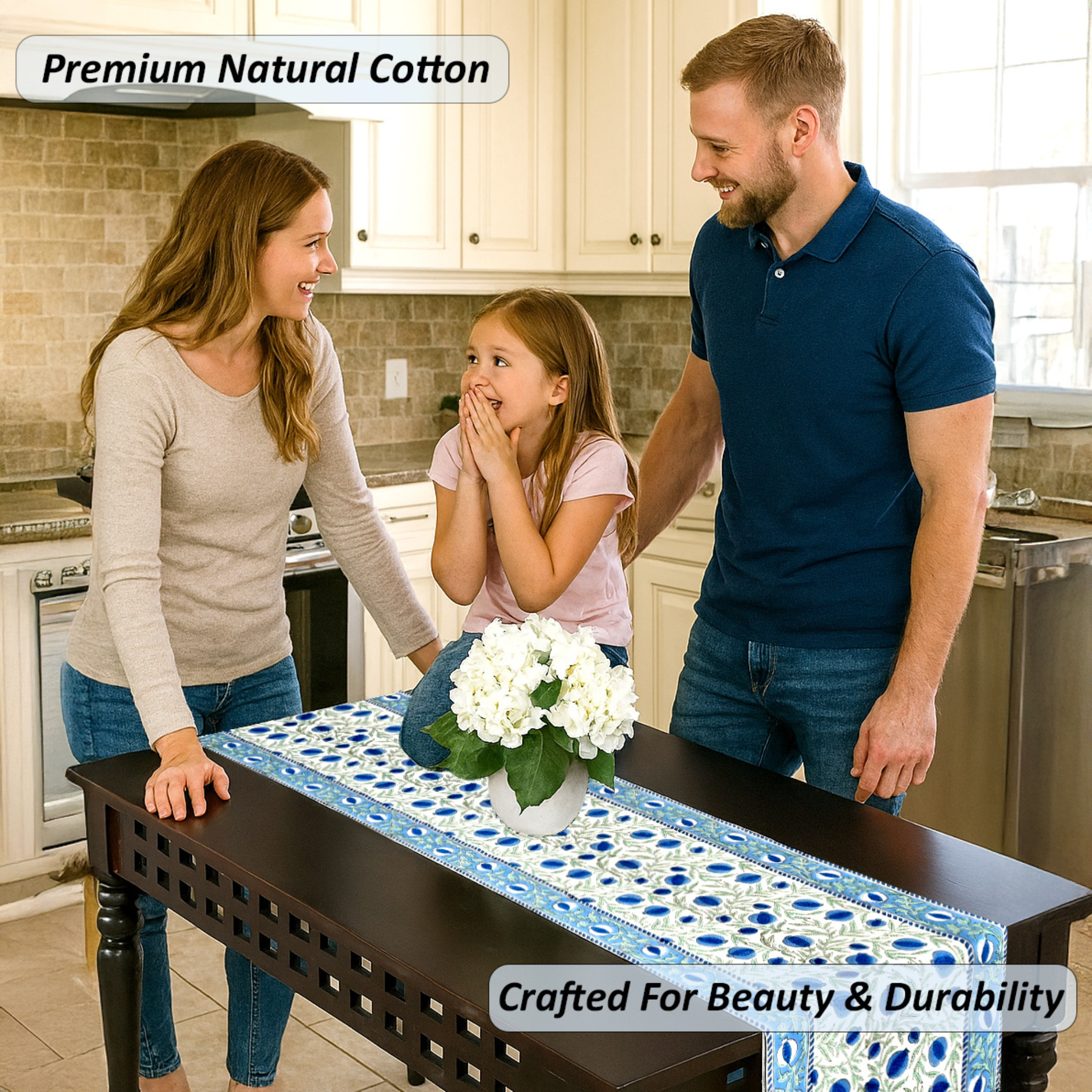 Family in a kitchen with a table runner featuring white flowers.