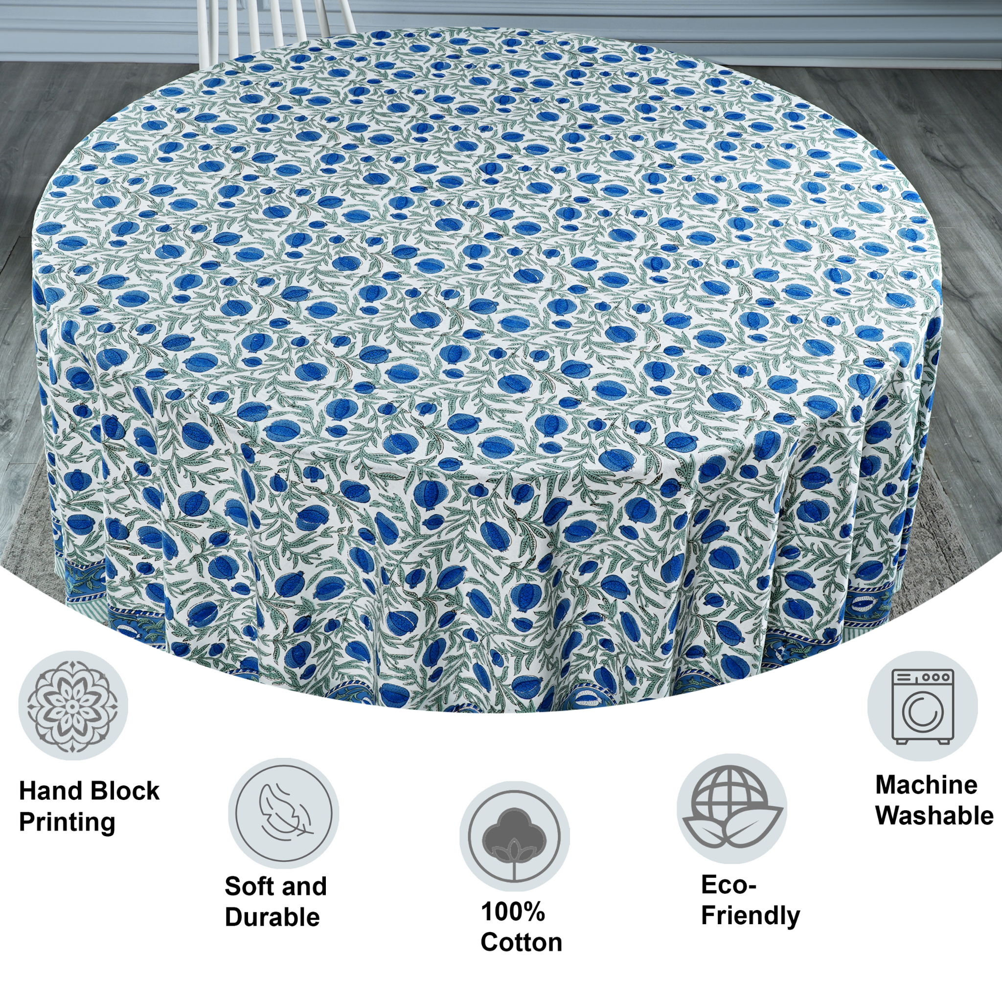 Round tablecloth with blue floral pattern on a wooden floor, featuring icons and text about material and care.