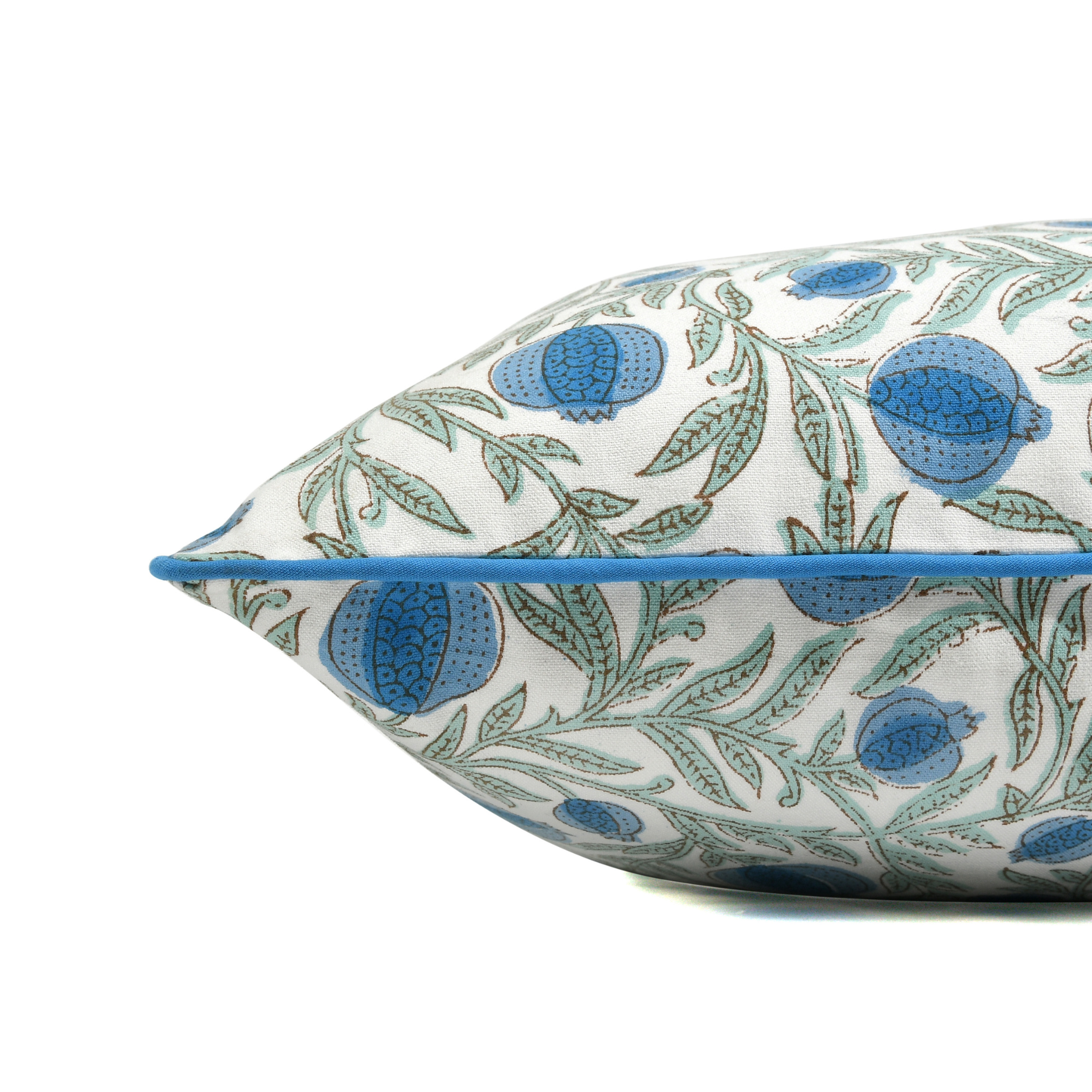 Decorative pillow with blue and green floral pattern on a white background