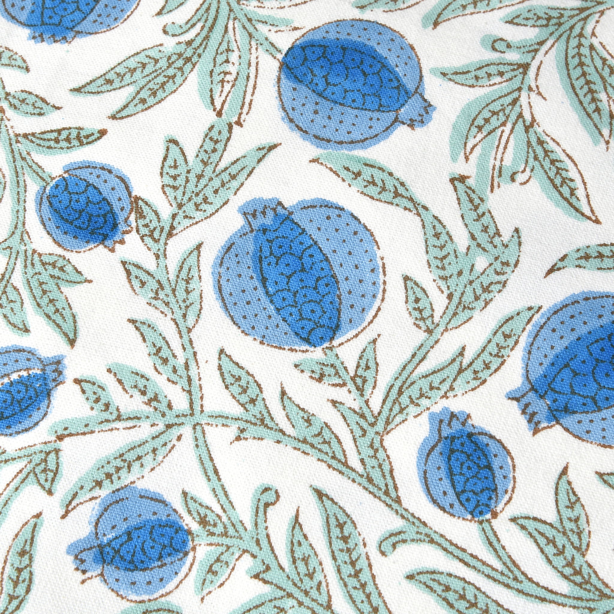 Pattern of blue floral buds and green leaves on a white background