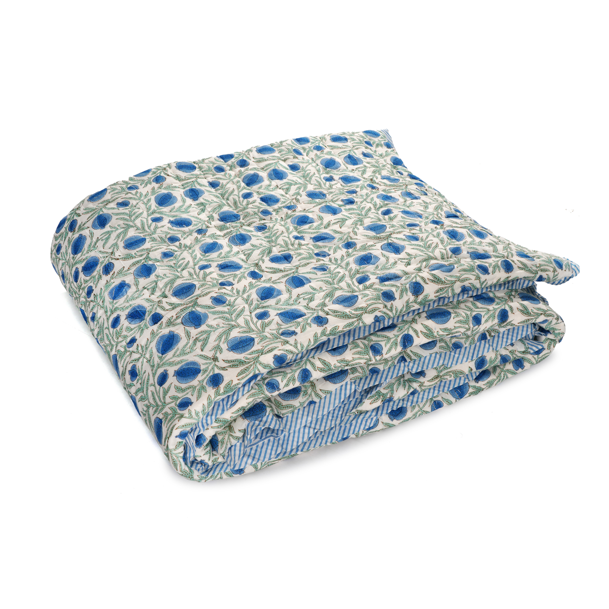 Folded fabric with blue and green pattern on a white background