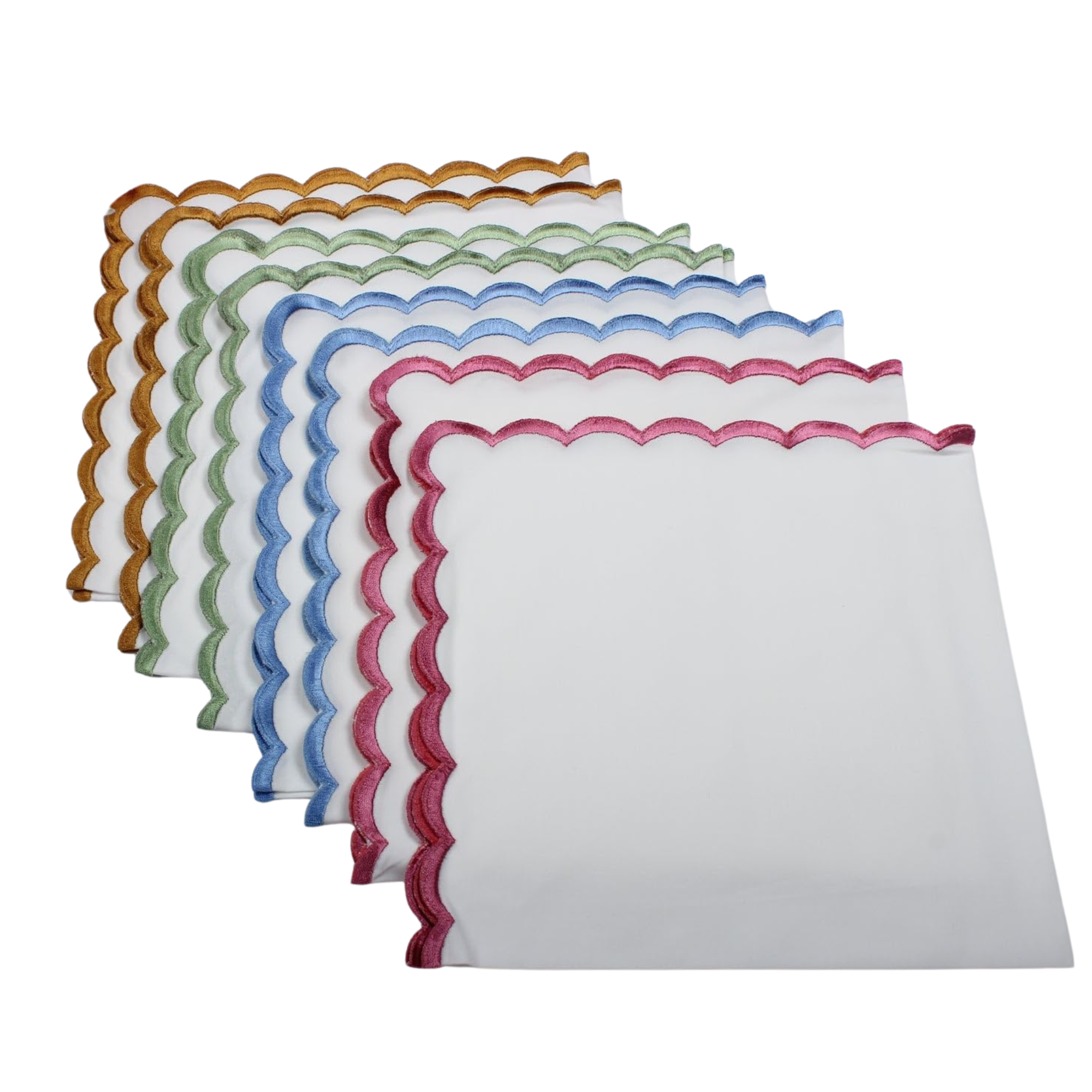 Set of colorful scalloped edge napkins on a white background