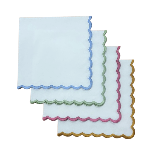 Set of three decorative napkins with colorful scalloped edges on a white background