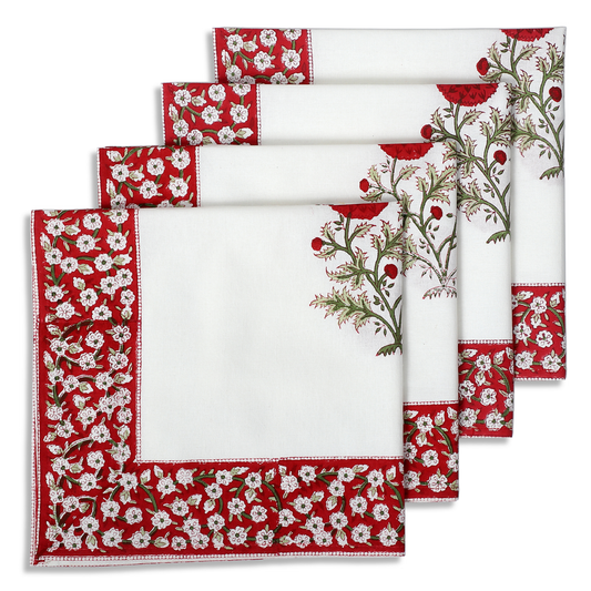 Set of red and white floral patterned napkins on a white background