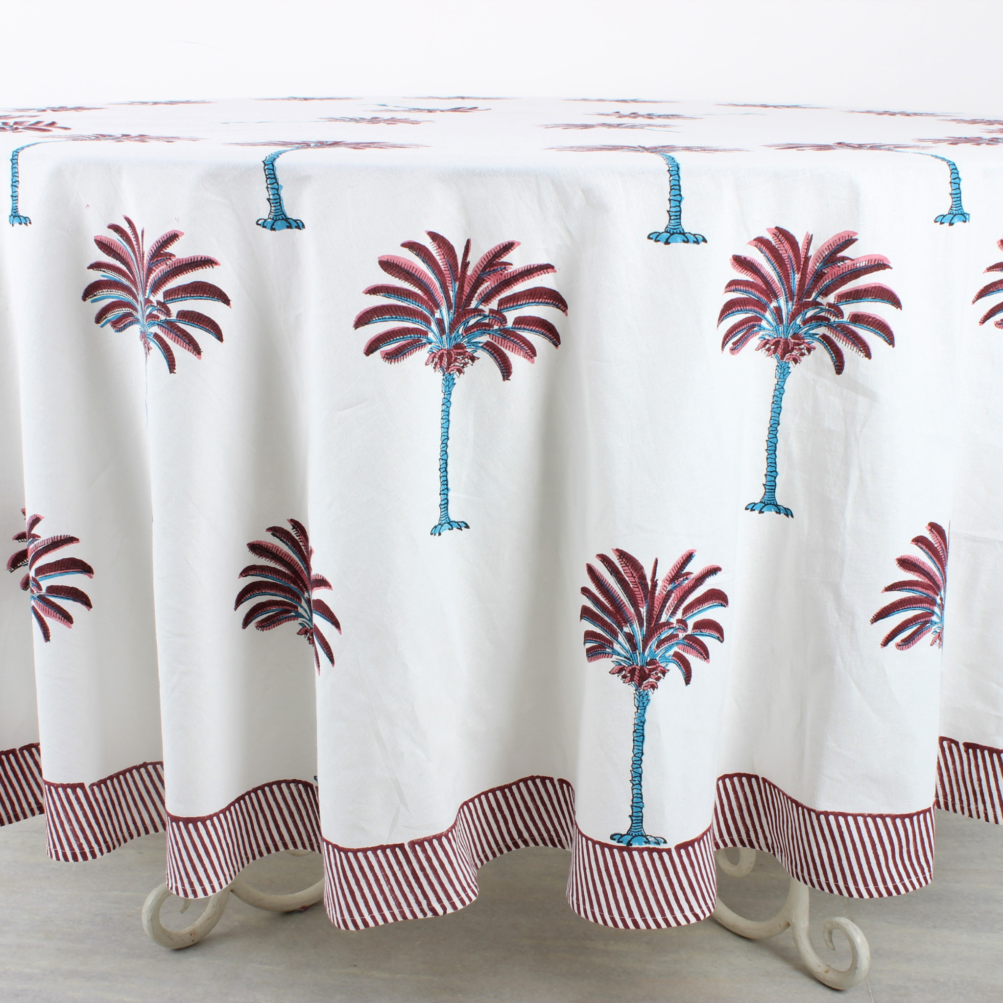 Tablecloth with palm tree design on a wooden table