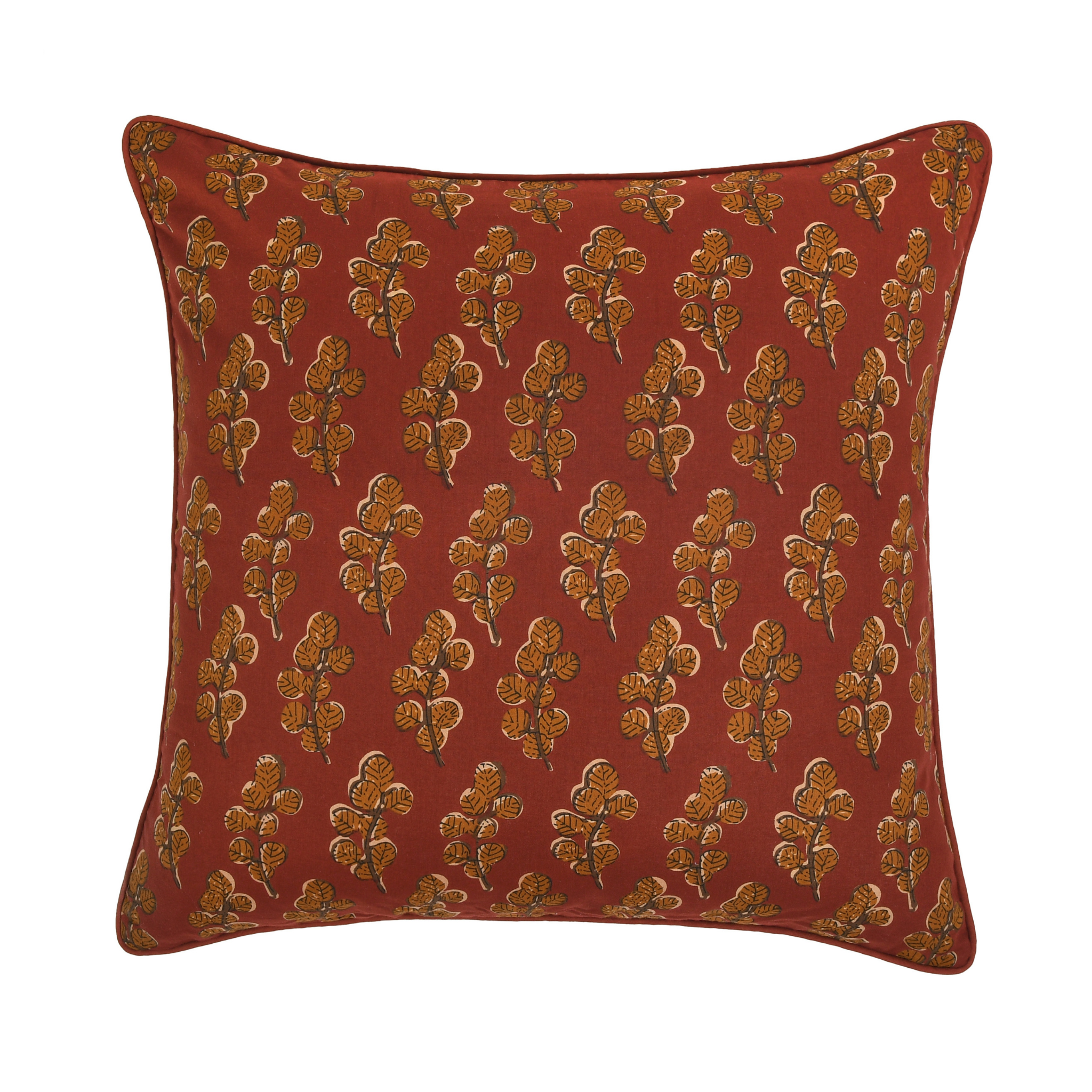 Red pillow with gold floral pattern on a white background