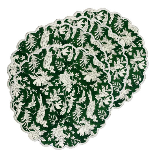 Round green placemat with white floral pattern on a white background