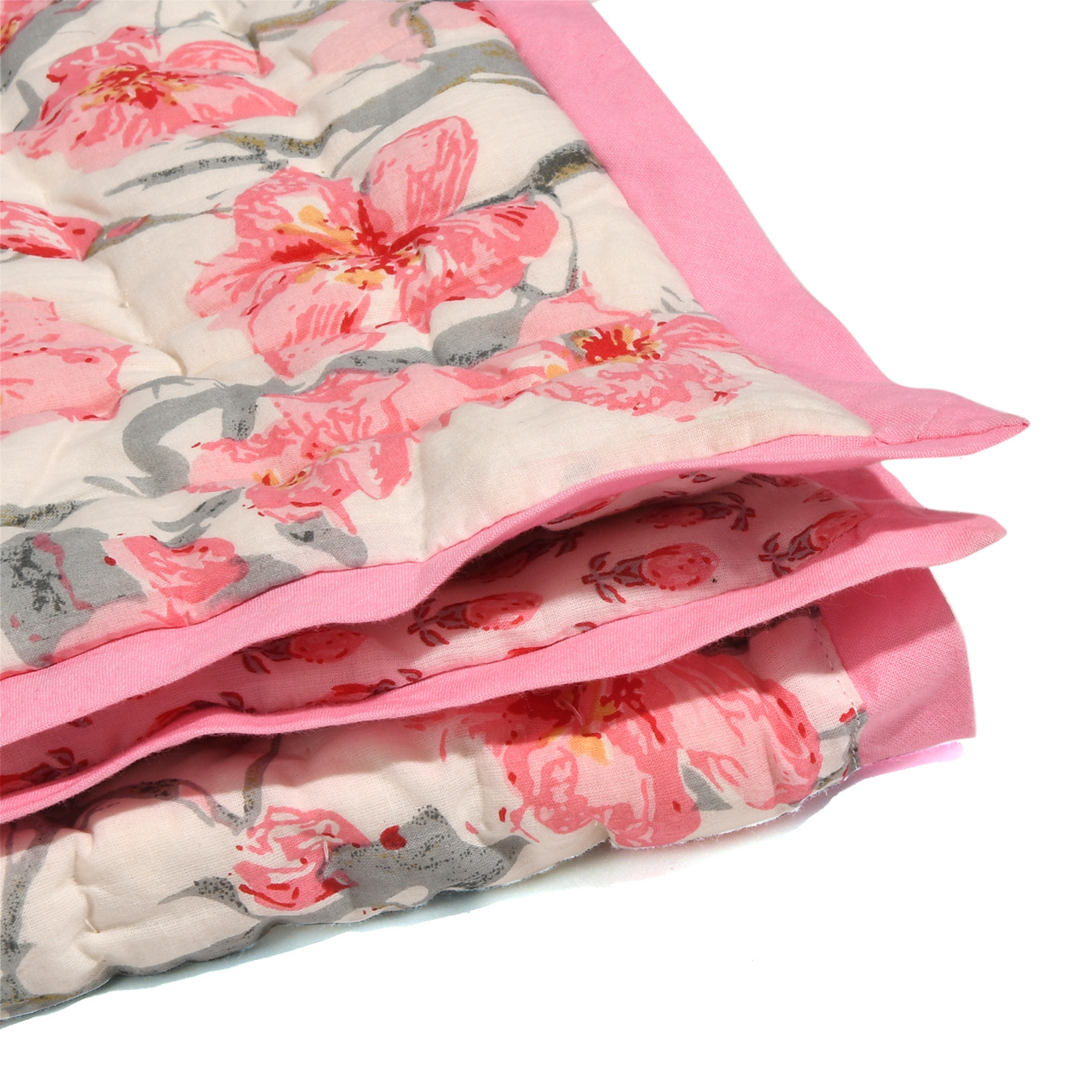 Floral-patterned blanket with pink and gray design on a white background