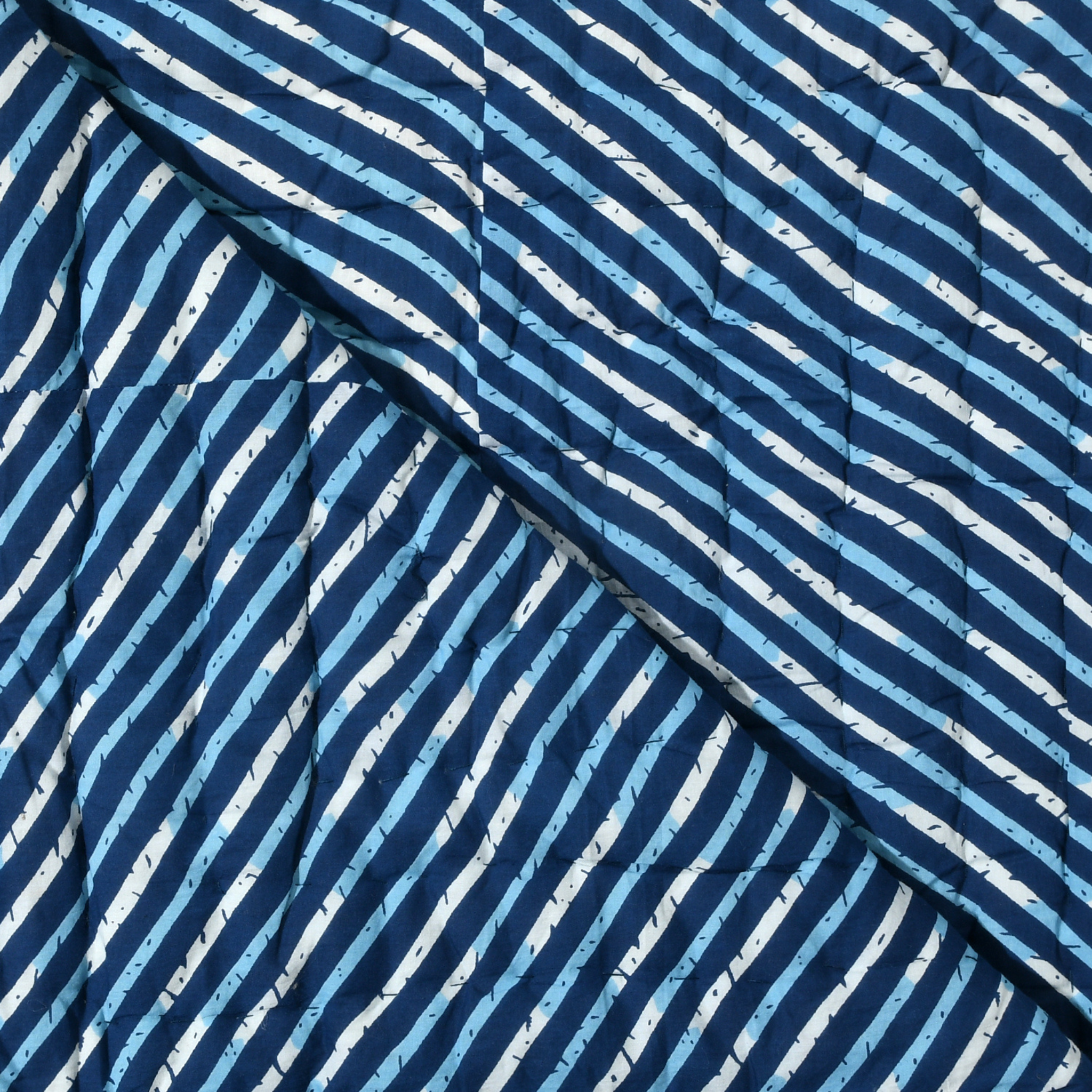Close-up of fabric with blue and white striped pattern