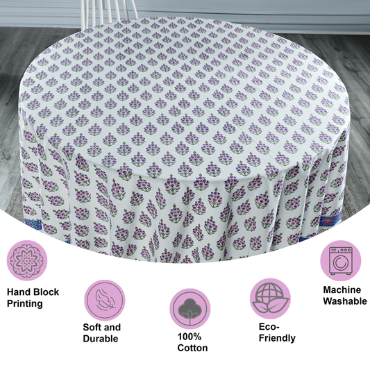 Round tablecloth with purple floral pattern on a wooden floor, featuring icons and text about material and care.