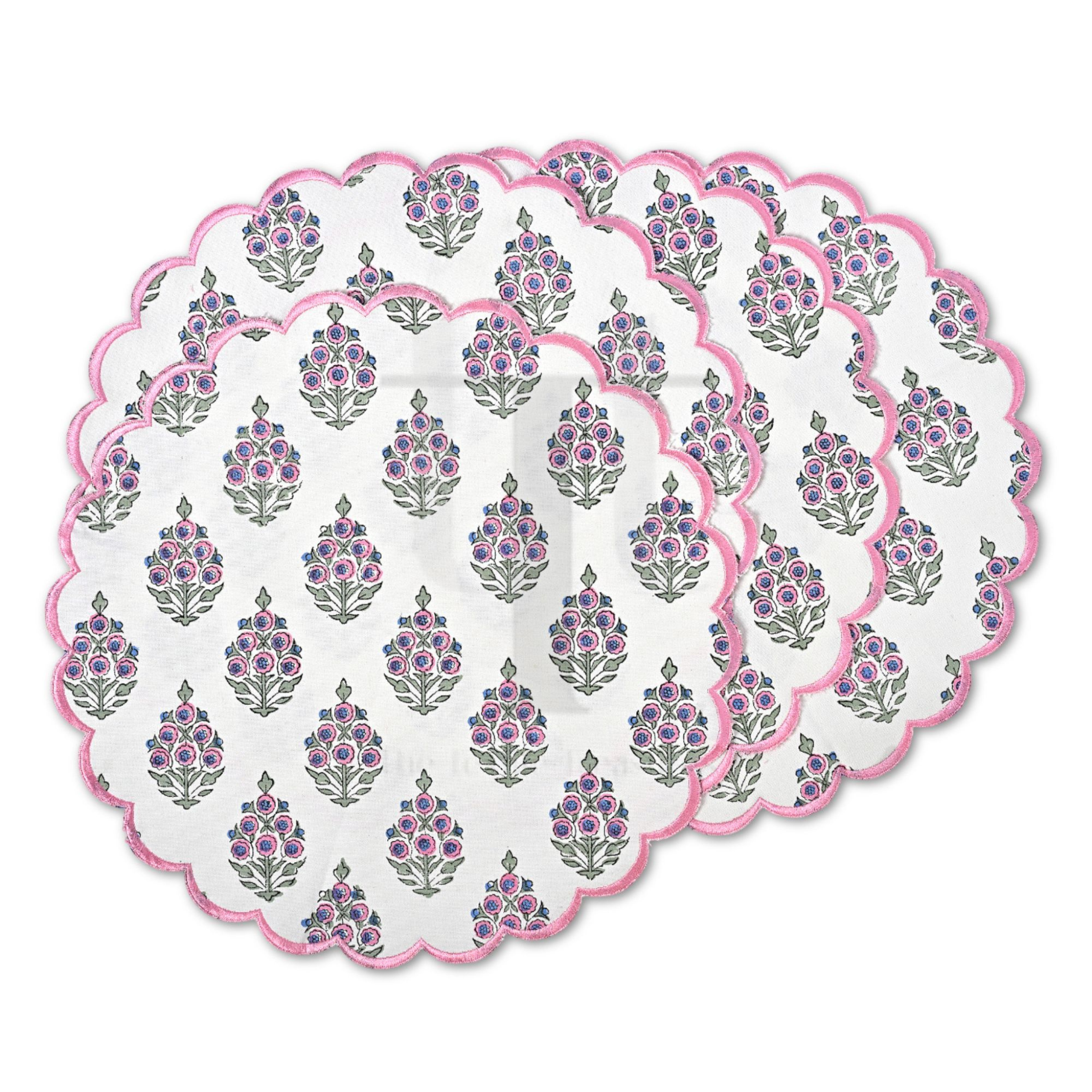 Set of round placemats with floral pattern on a white background