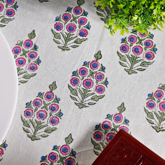 Floral patterned tablecloth with pink and blue flowers on a white background