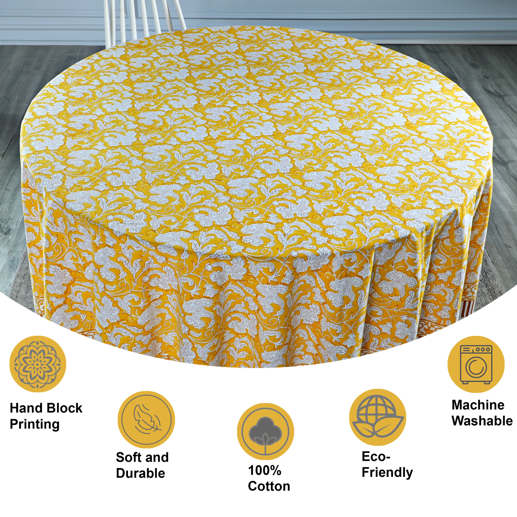 Yellow floral tablecloth on a round table with product features displayed below.