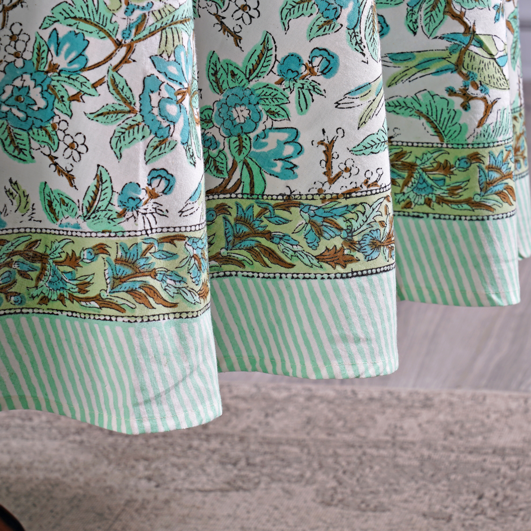 Floral and striped fabric with a neutral background