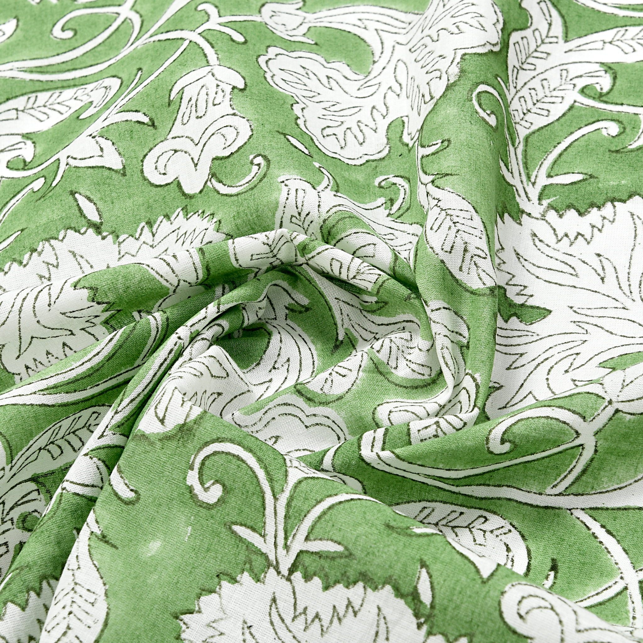 Green fabric with white floral and leaf pattern