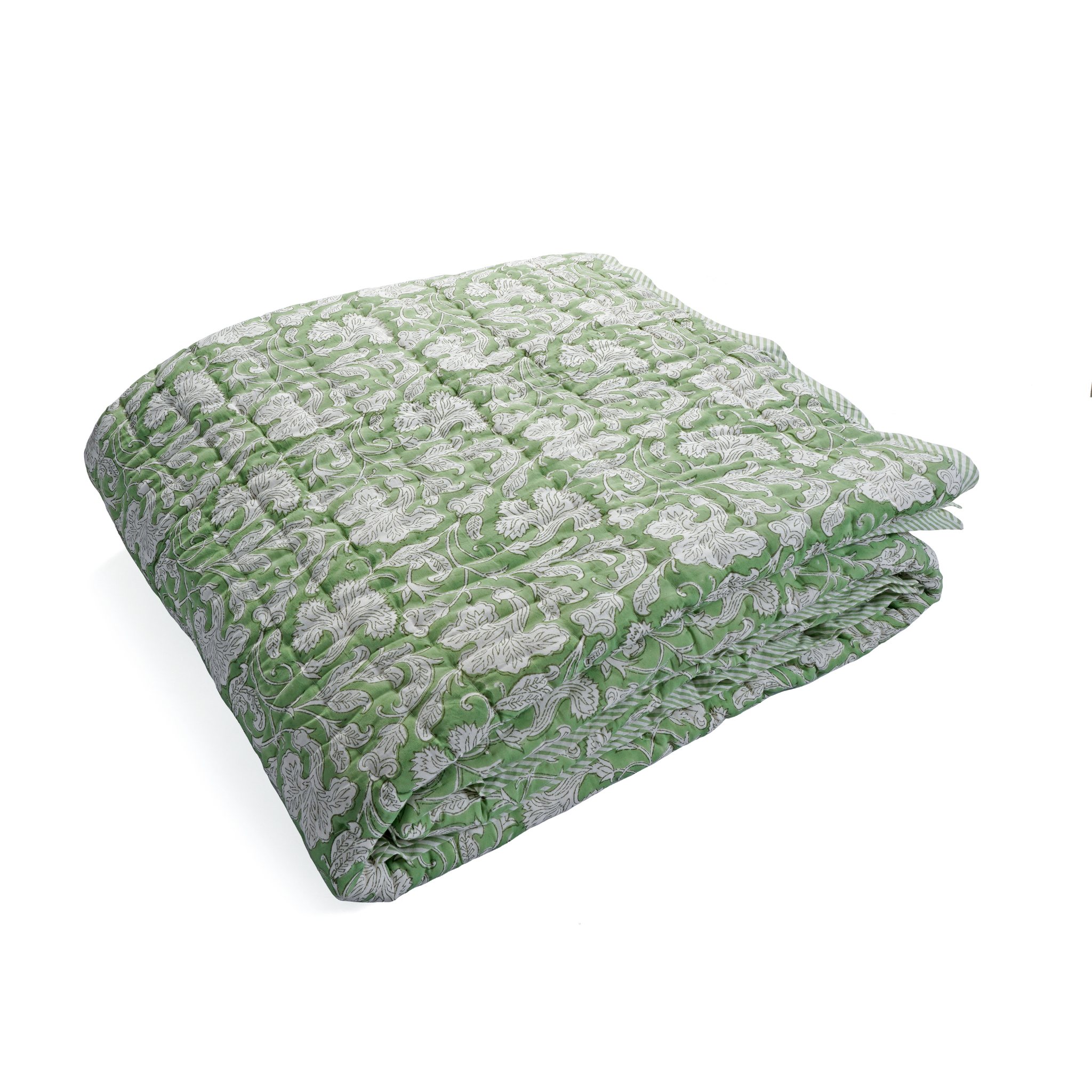 Green and gray patterned blanket on a white background