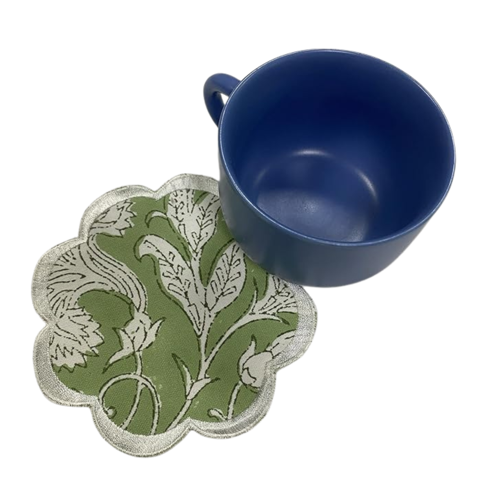Blue mug on a green floral coaster with white border