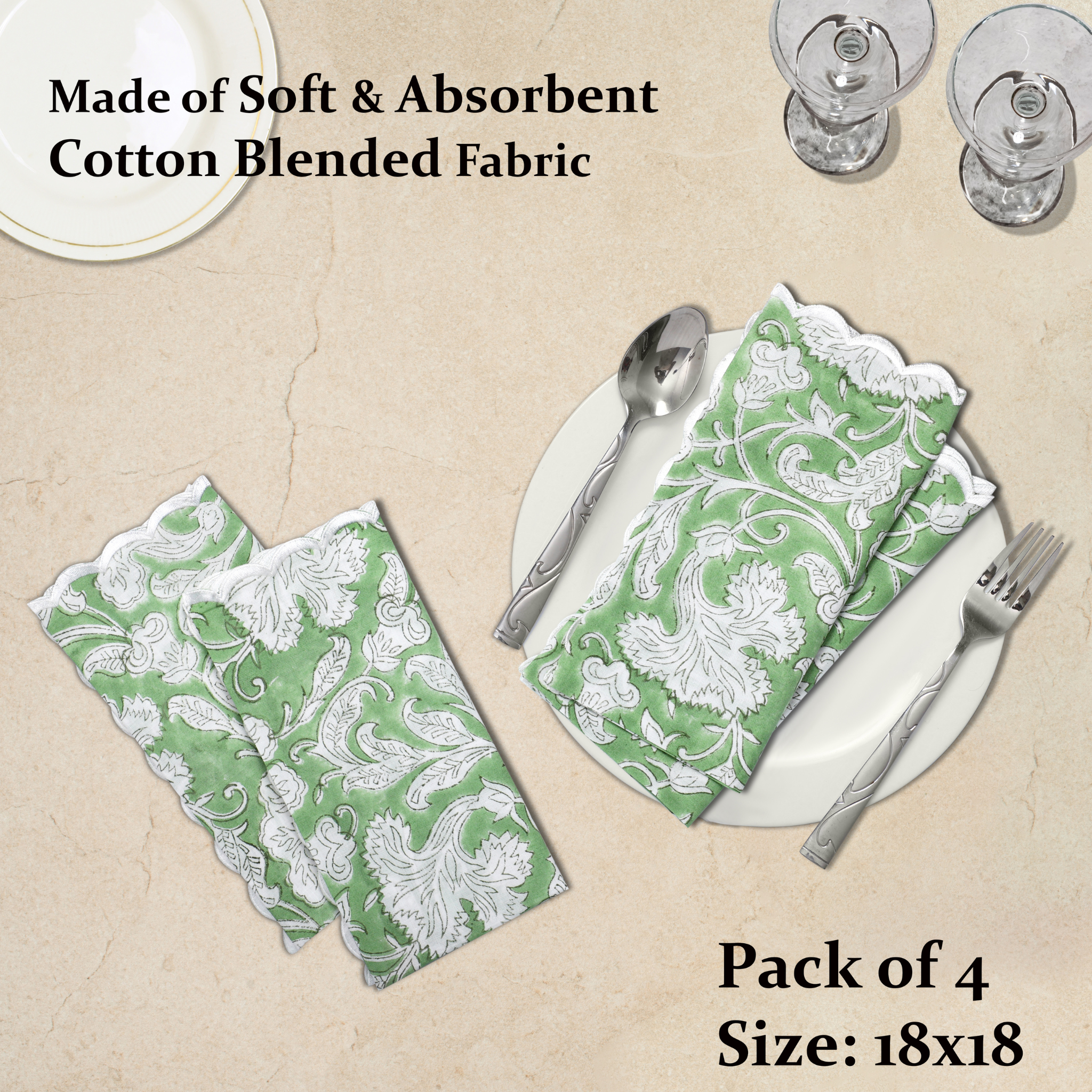 Green and white patterned napkins on a beige surface with cutlery.