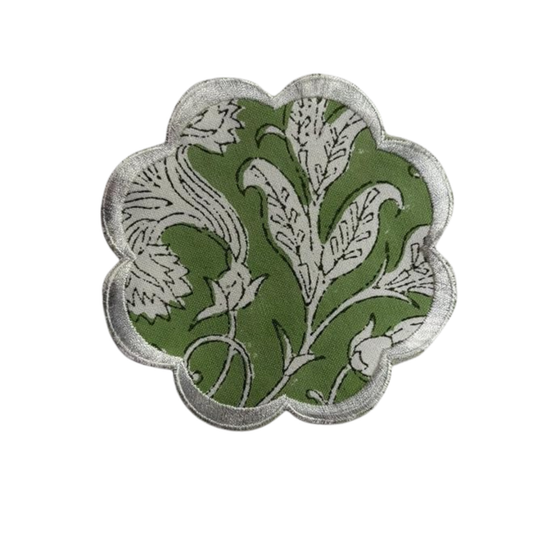 Decorative patch with green and white floral design on a white background