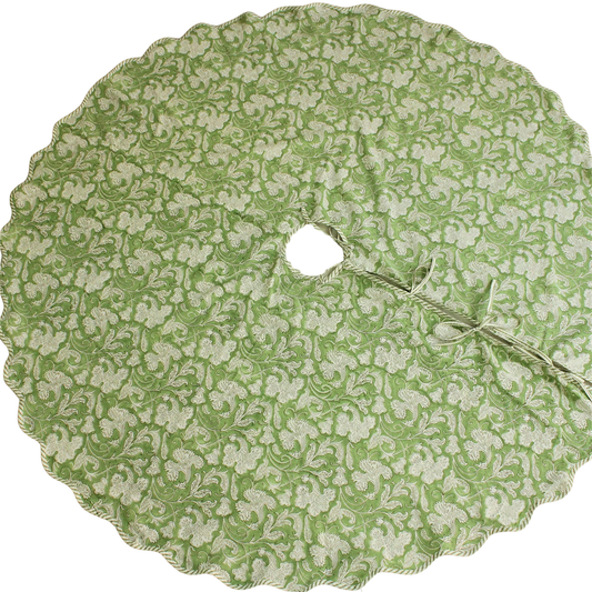 Green floral patterned tree skirt on a white background