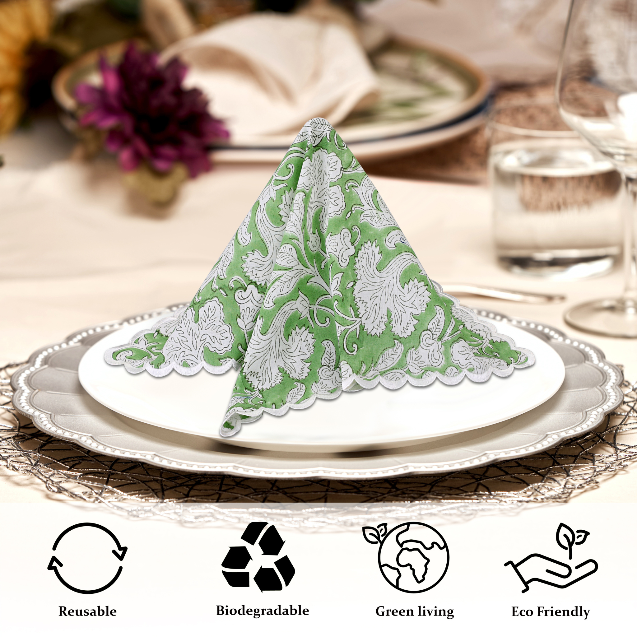 Decorative green and white folded napkin on a table setting with eco-friendly icons below.