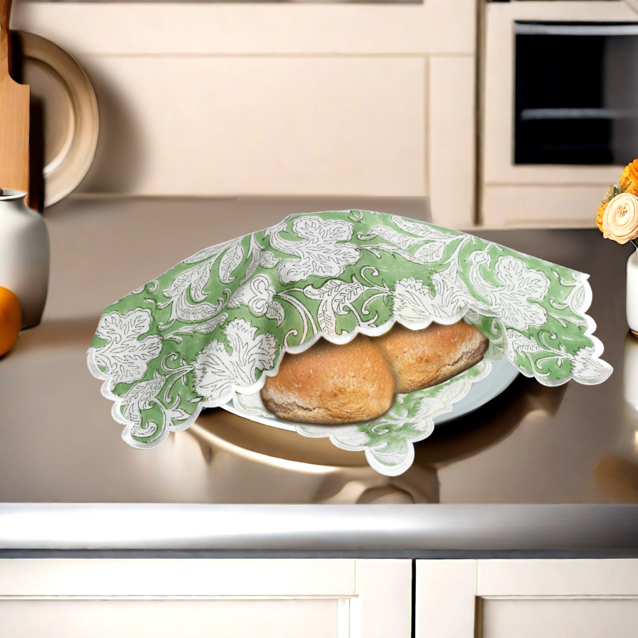 Decorative green lace cover on a plate with bread in a kitchen setting