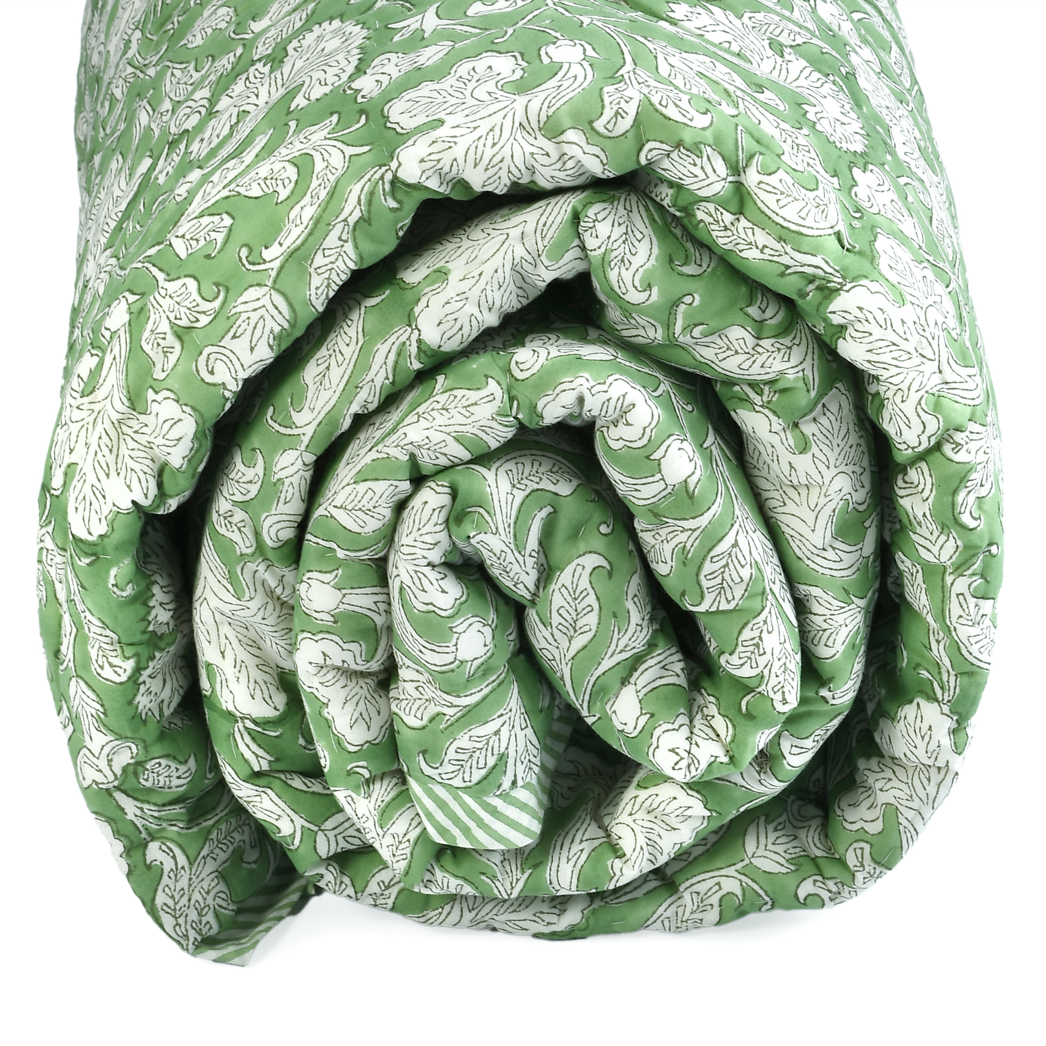Rolled-up green and white patterned blanket on a white background