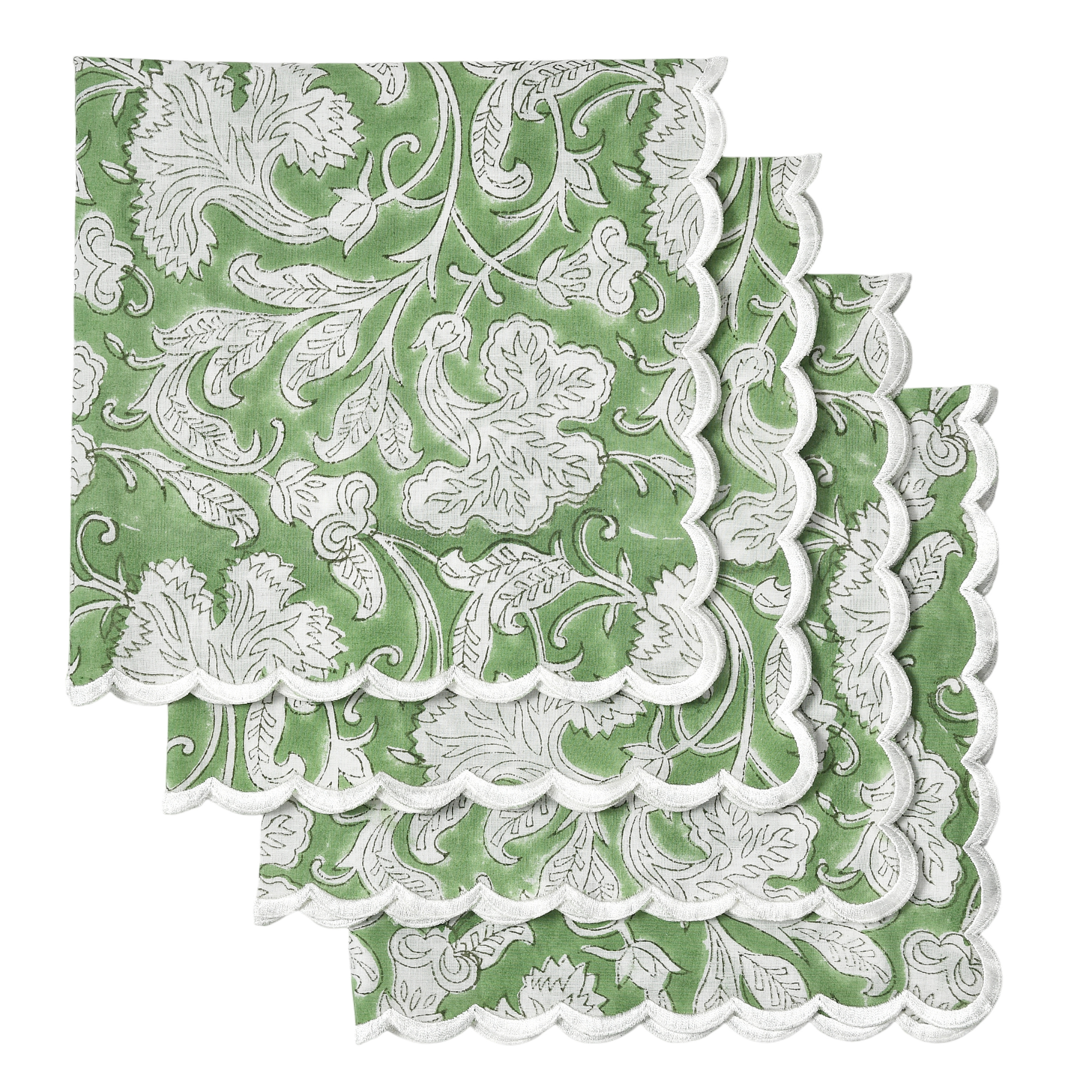 Green and white floral patterned paper napkins with scalloped edge on a white background