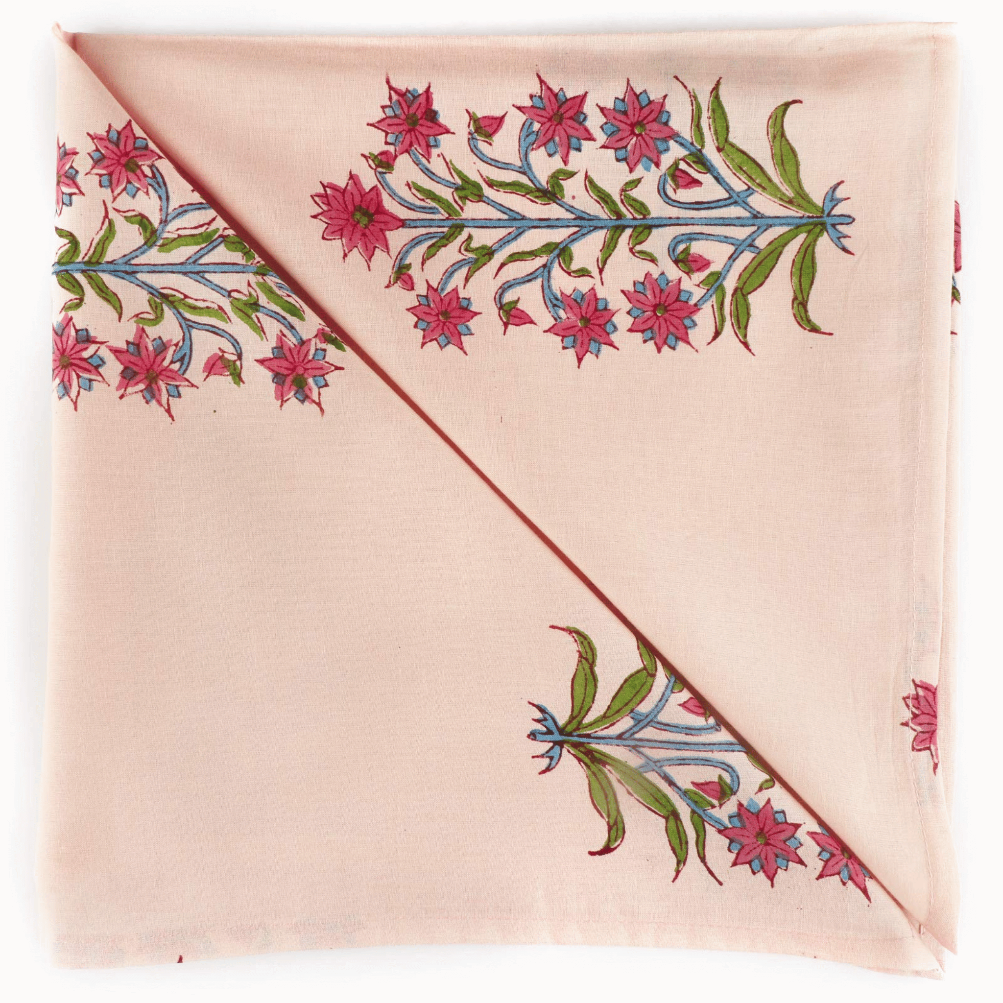 Pink fabric with floral embroidery on a white background