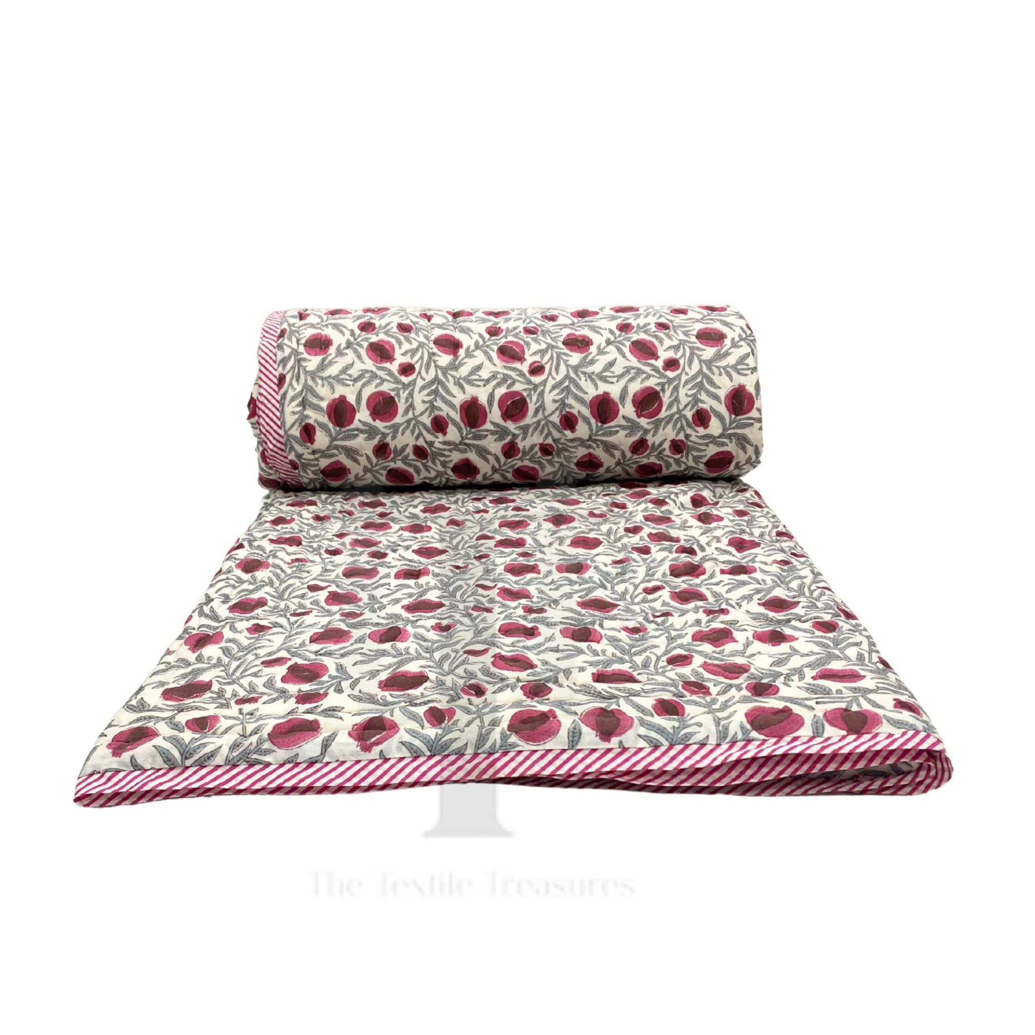 Roll of fabric with red floral pattern on a white background