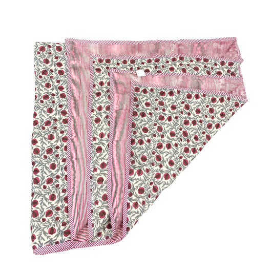 Set of three pink and white patterned cloths on a white background