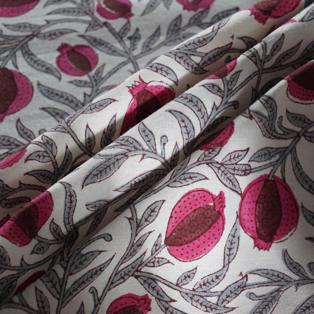 Fabric with pomegranate pattern on a light background