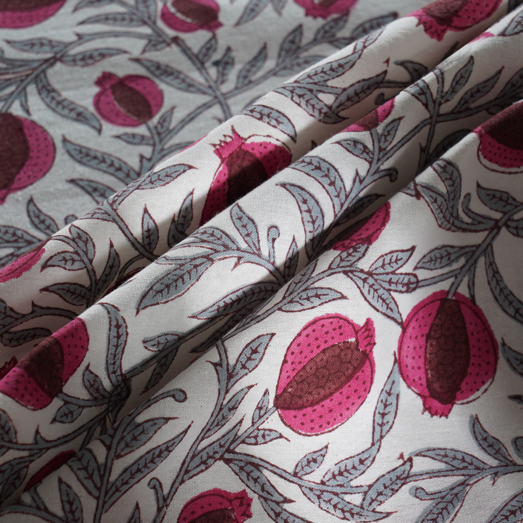Fabric with pomegranate pattern on a light background