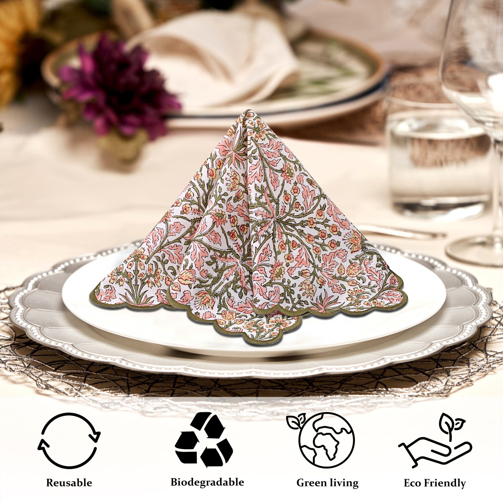 Folded floral napkin on a plate with eco-friendly icons below