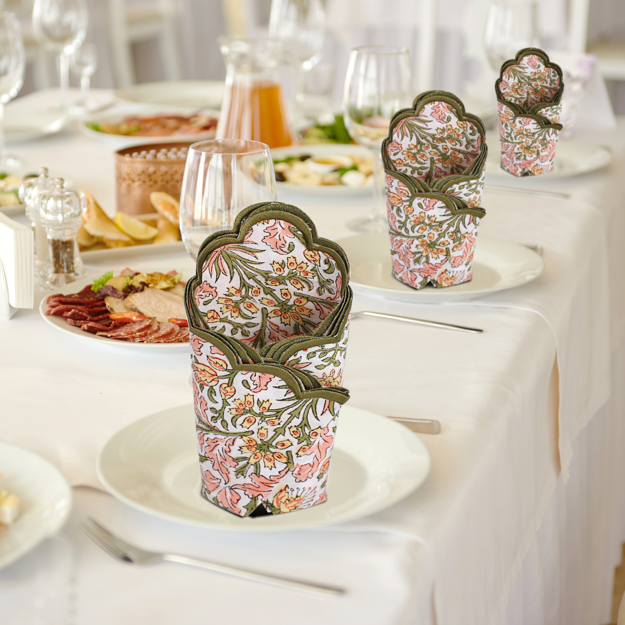 Decorative paper cups with floral pattern on a table setting