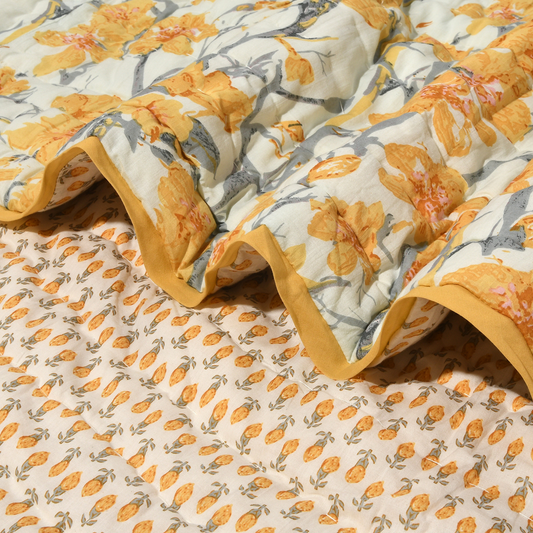 Floral patterned fabric with yellow and gray flowers on a beige background