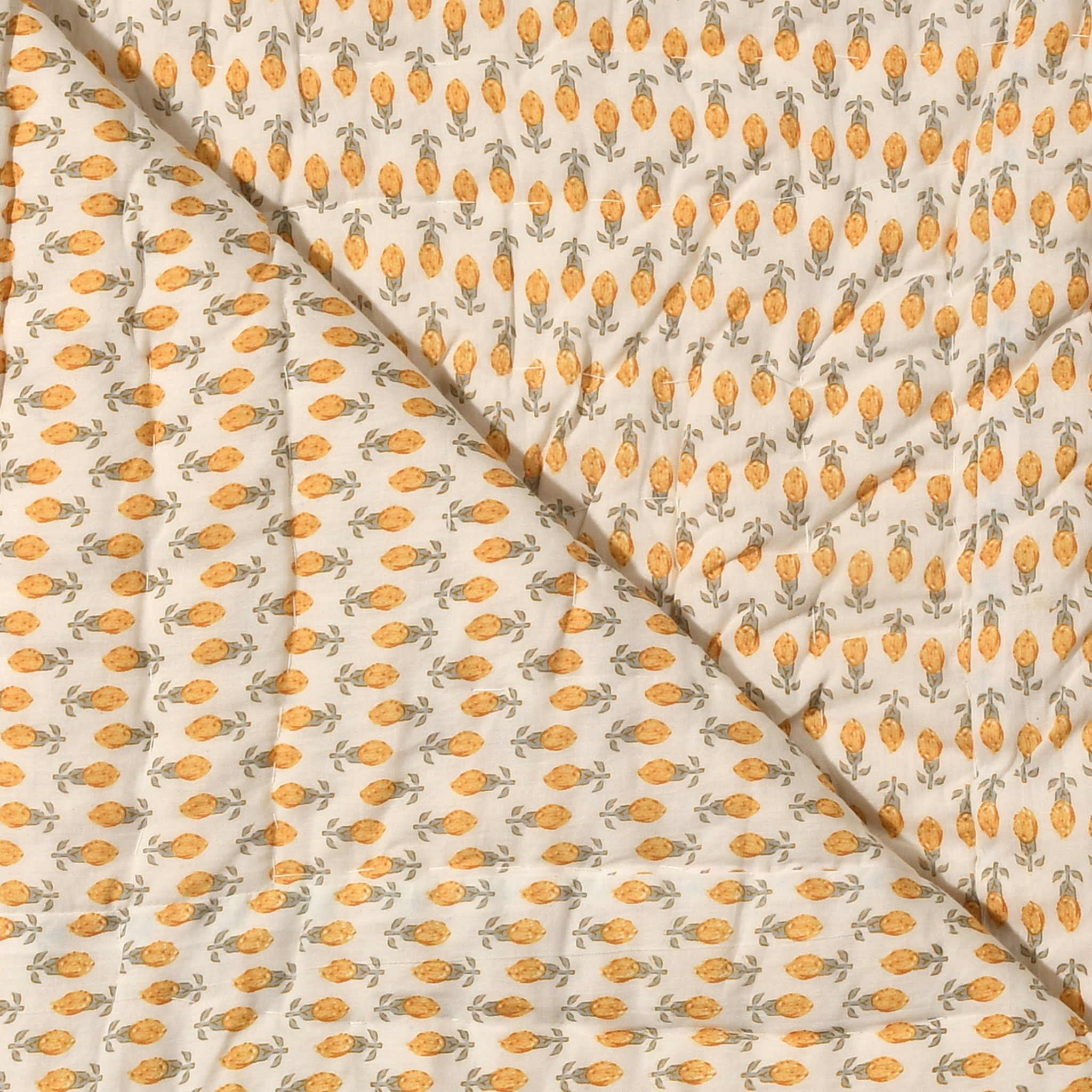 Fabric with a pattern of orange shapes on a beige background